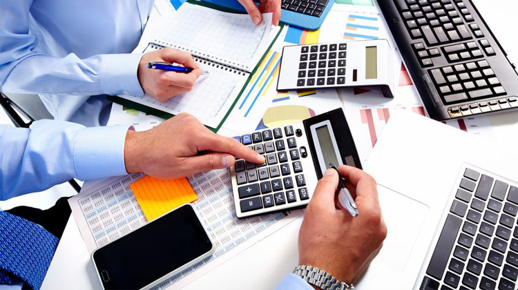 This image illustrates small business accounting and financial management, showing professionals reviewing documents, using calculators, and organizing financial data. It is suitable for content about Small Business Accountant, bookkeeping, budgeting, cash flow, and tax planning.