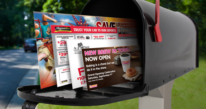 A residential mailbox containing colorful promotional flyers, coupons, and business advertisements, demonstrating the delivery of printed marketing materials directly to potential customers.