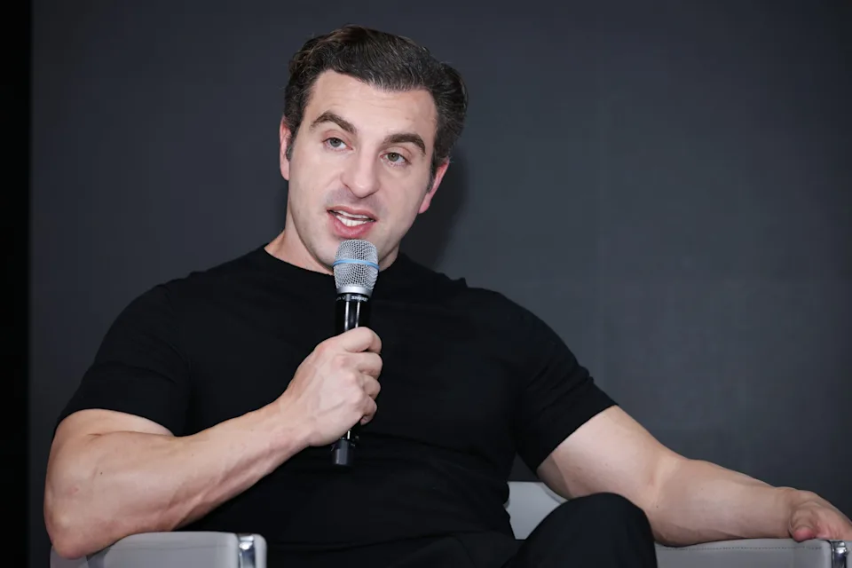 This image is used to visually represent Brian Chesky, co-founder and CEO of Airbnb, in an article about his net worth, career, and entrepreneurial success.