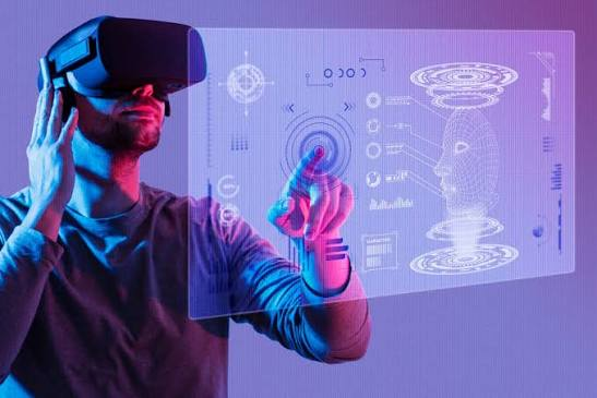 This image is suitable for content about virtual reality (VR), augmented reality (AR), immersive technology, and the metaverse. It shows a person using a VR headset and interacting with a futuristic digital interface, making it useful for articles about VR applications, digital experiences, emerging technology, 3D interfaces, and the future of computing.