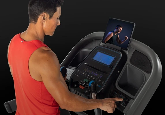 Black Friday treadmill deals 2026 featuring a man running on a modern treadmill with special discounts.